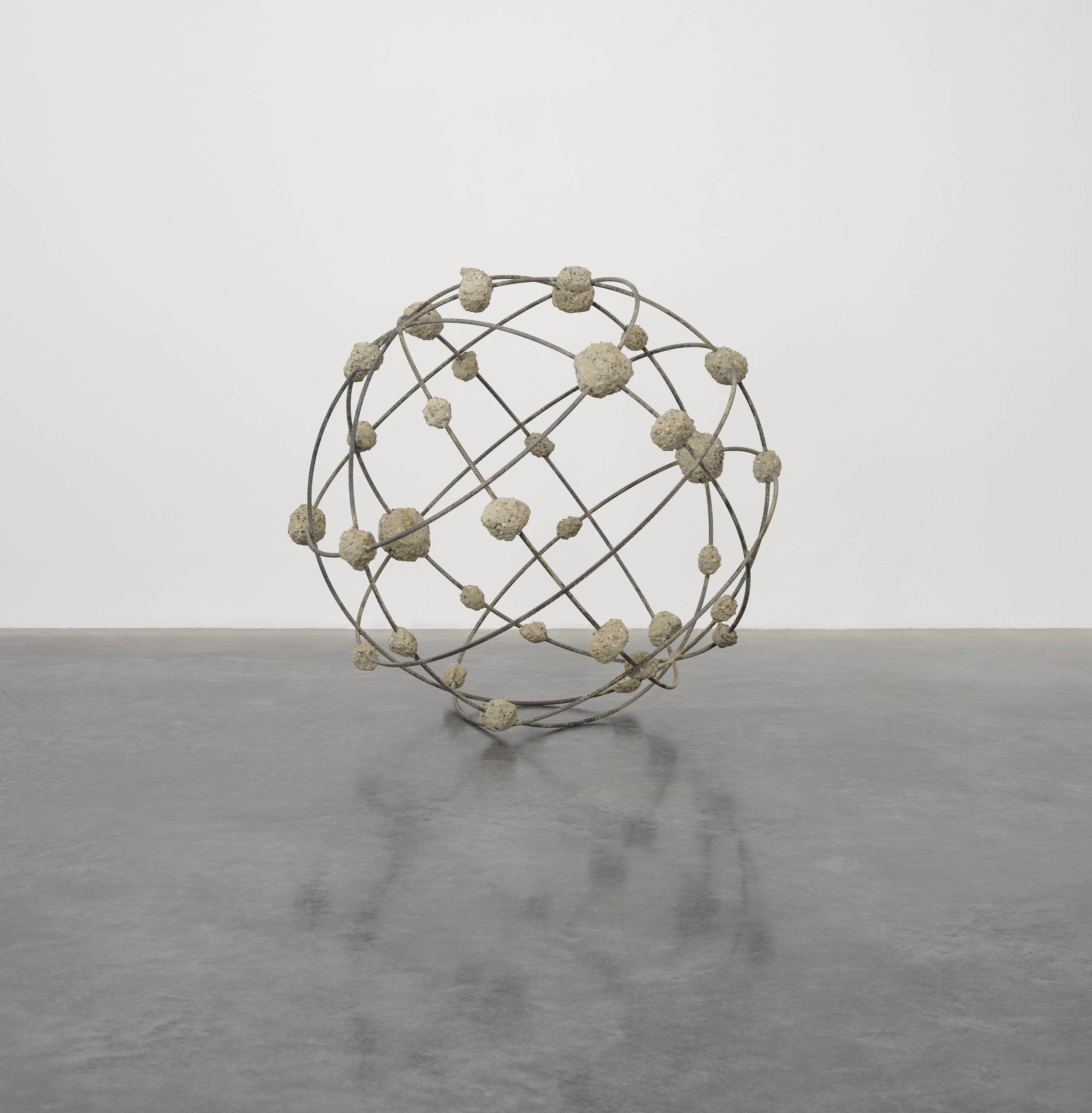A sculpture in the form of a sphere, it is made from a wire frame with globules of different sizes adhering to the wires and their junctions